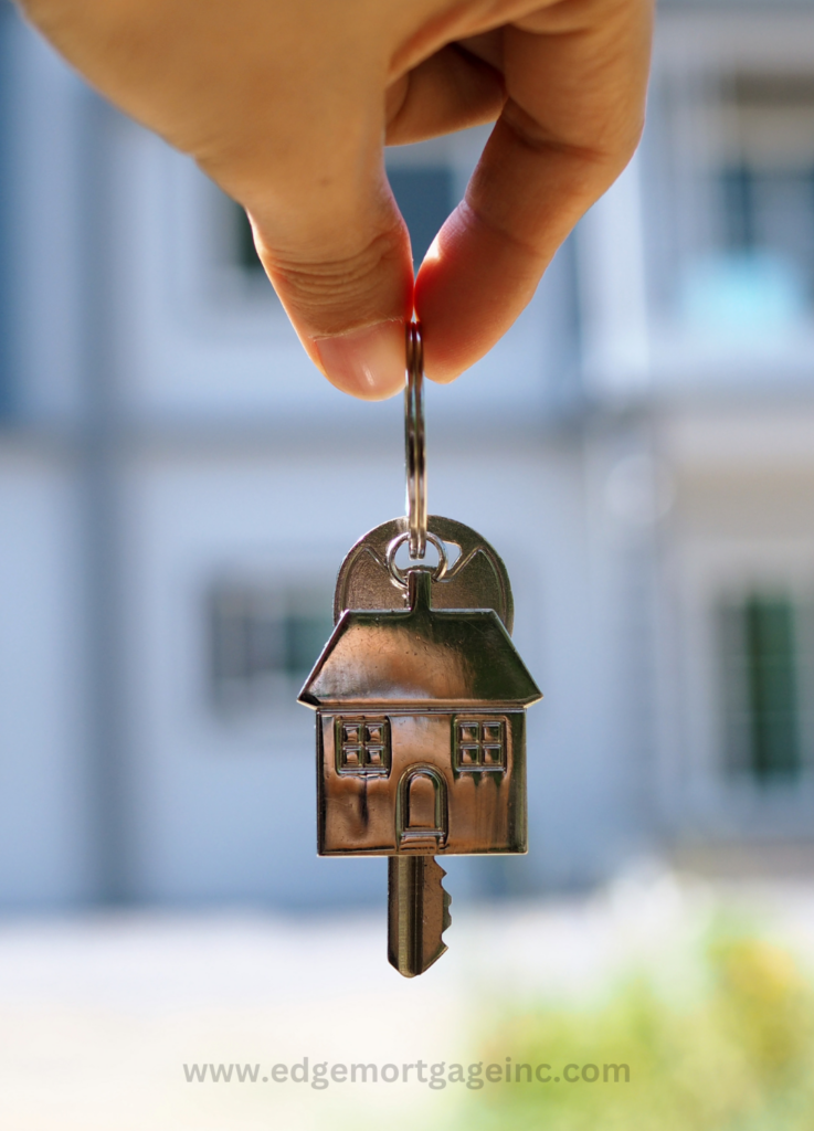 get a mortgage quote - Person holding keys in front of a house