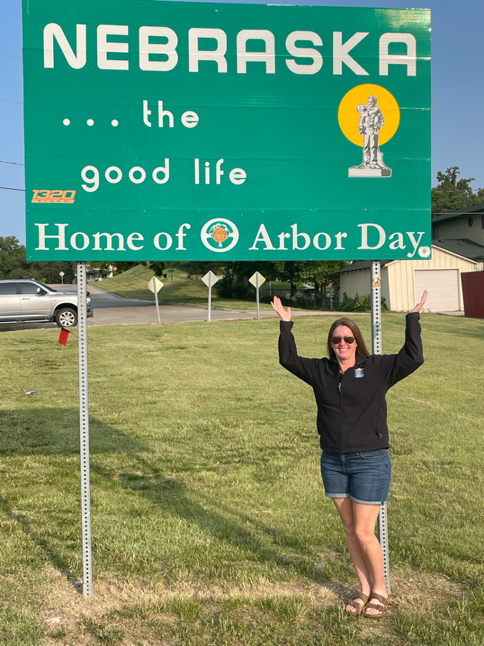 Nebraska Mortgage Broker - Keri Imhof at Nebraska state line sign