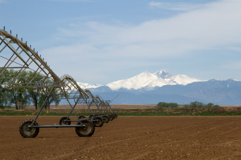 Milliken mortgage broker - View of field and mountains in the background in Northern Colorado