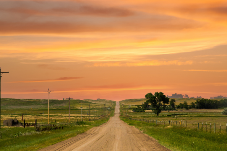 Sterling Mortgage Broker - Dirt road in Sterling, Colorado with the sunset in the background